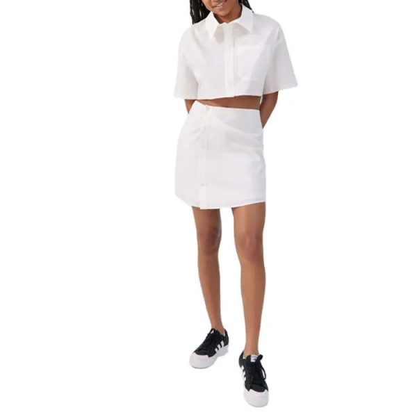 Two piece set women short sleeve shirt with tab collar paired with a mini skirt cotton material